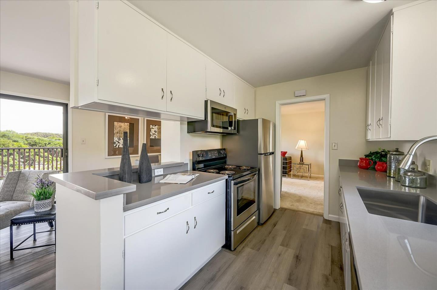 1092 Crestview Drive Millbrae, CA 94030 - Photo 11 of 34 a kitchen with granite countertop a sink stove and refrigerator