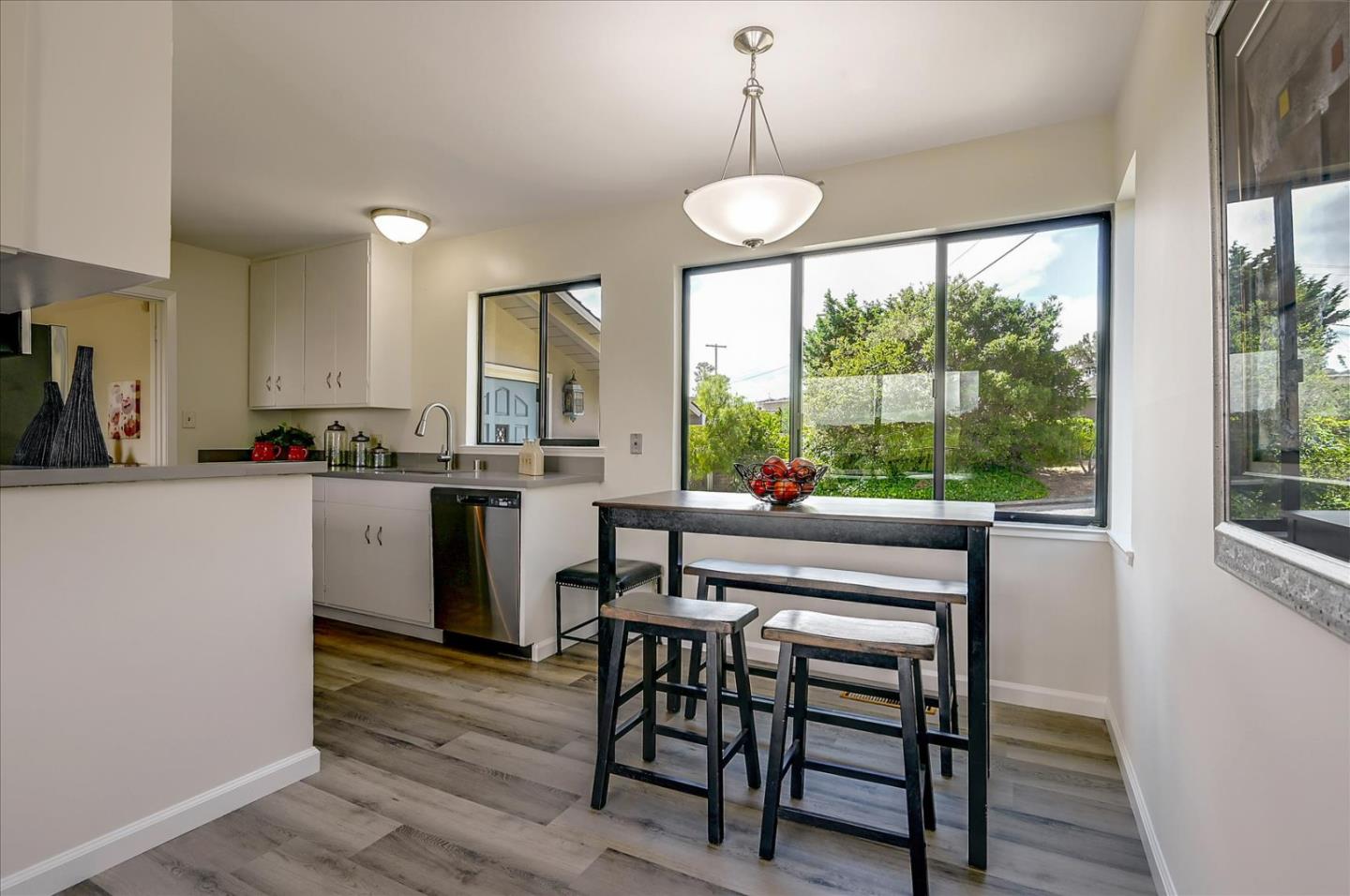 1092 Crestview Drive Millbrae, CA 94030 - Photo 12 of 34 a kitchen with a table chairs sink and cabinets