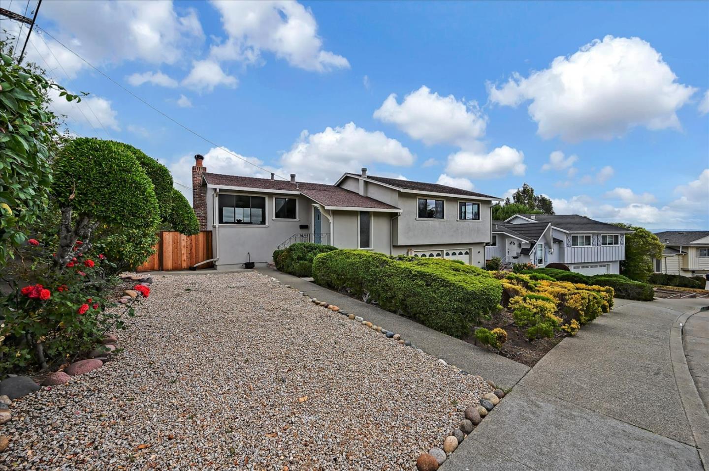 1092 Crestview Drive Millbrae, CA 94030 - Photo 2 of 34 a front view of a house with a yard and potted plants