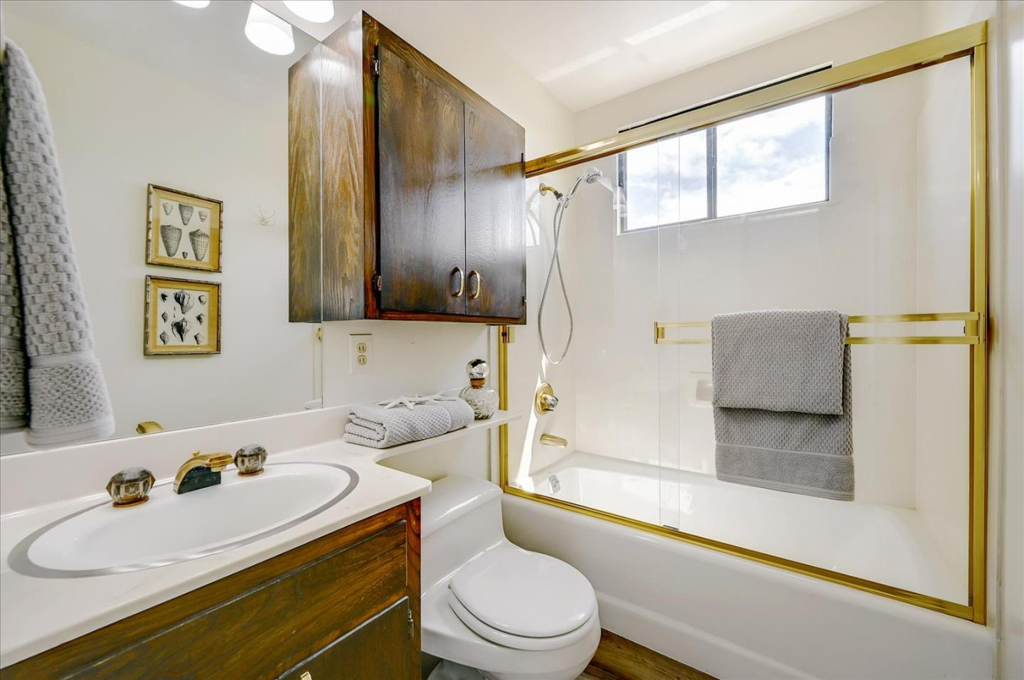 1092 Crestview Drive Millbrae, CA 94030 - Photo 23 of 34 a bathroom with a sink a toilet and shower