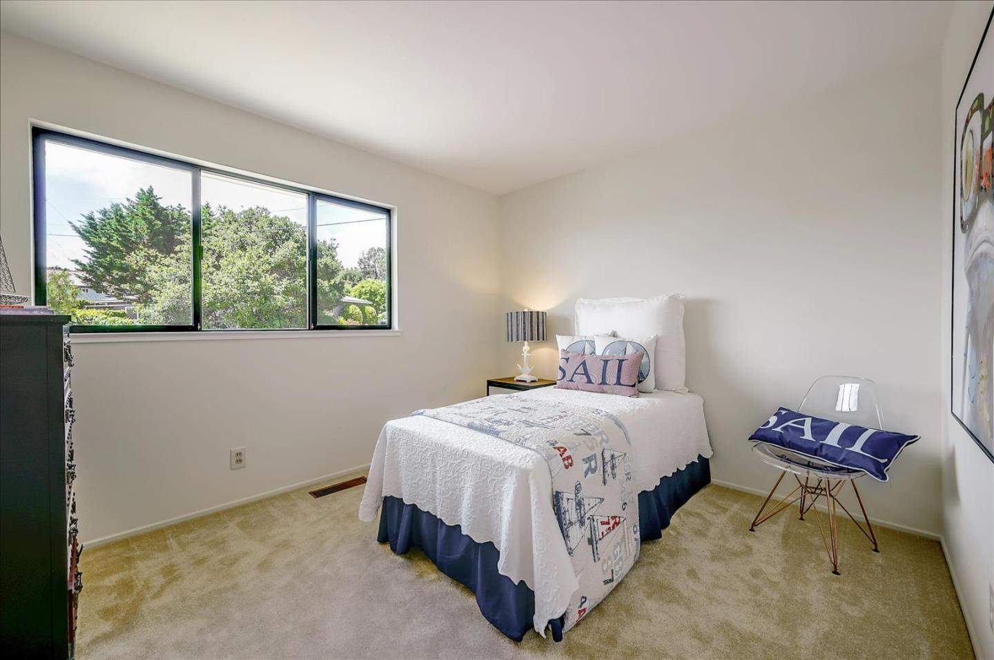 1092 Crestview Drive Millbrae, CA 94030 - Photo 24 of 34 a bedroom with a bed chair and a large window