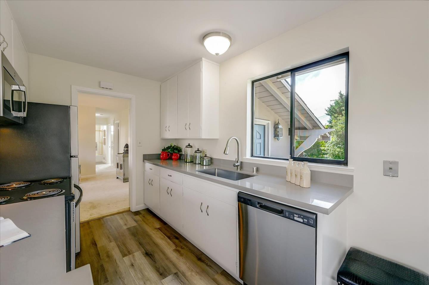 1092 Crestview Drive Millbrae, CA 94030 - Photo 10 of 34 a kitchen with a sink cabinets and window