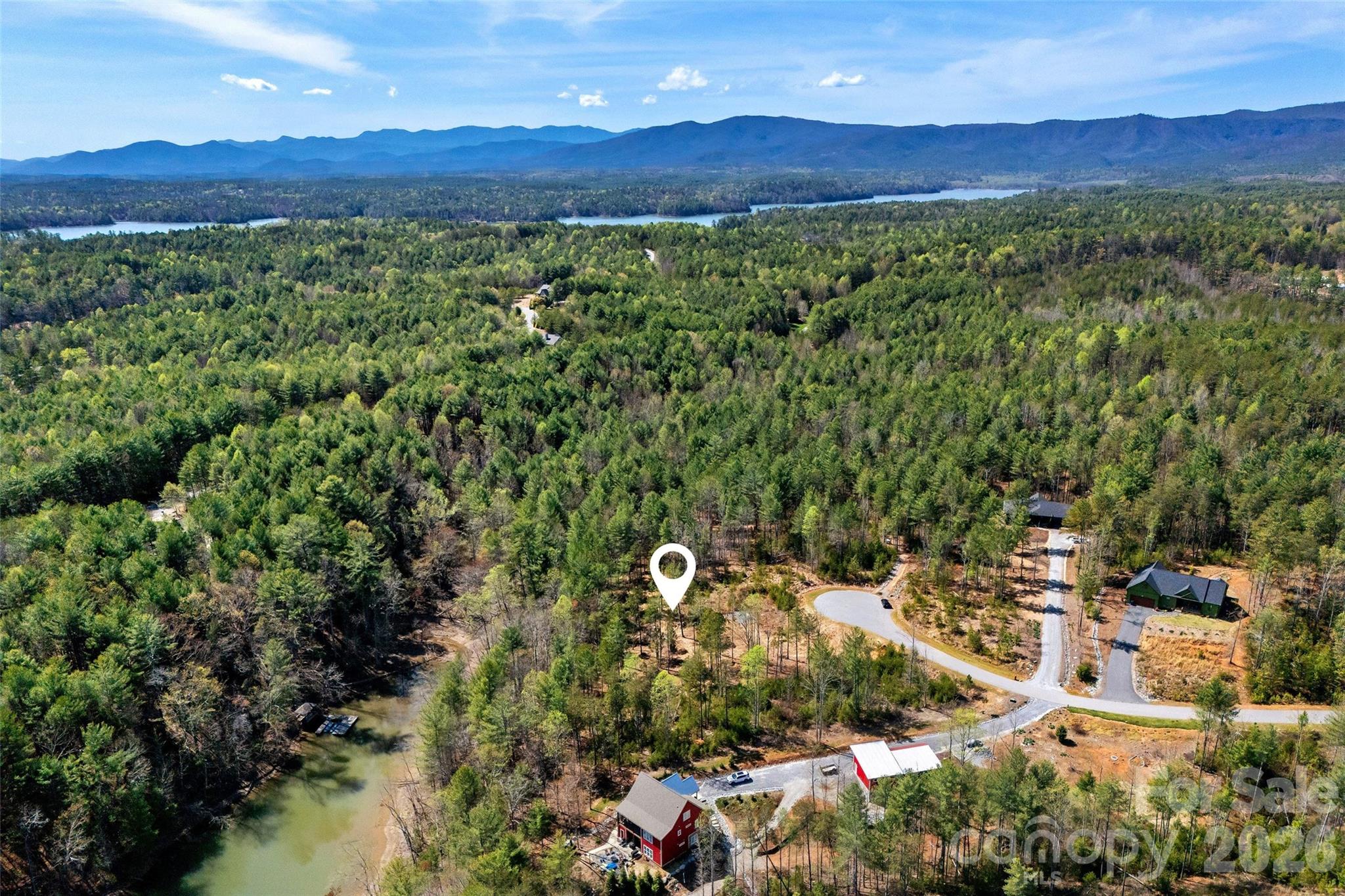 3107 Channel View Cove Morganton, NC 28655 - Photo 3 of 24 a view of a lush green hillside and a houses