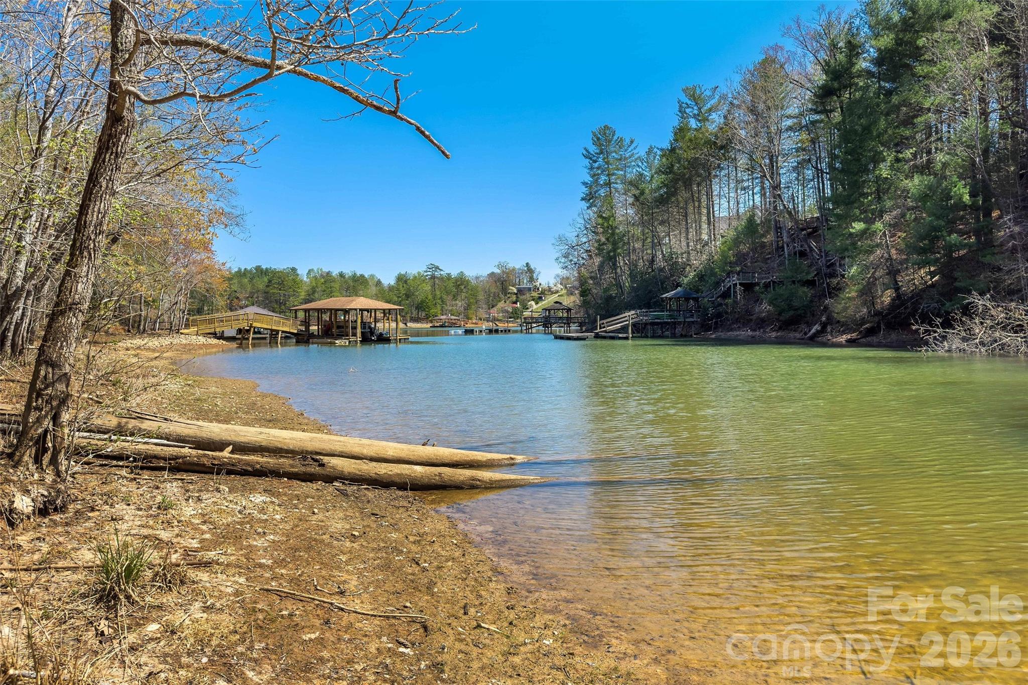 3107 Channel View Cove Morganton, NC 28655 - Photo 9 of 24 a view of a lake with houses in the back