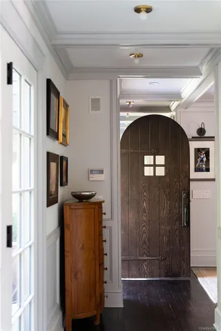 a living room with a fireplace and a wooden floor