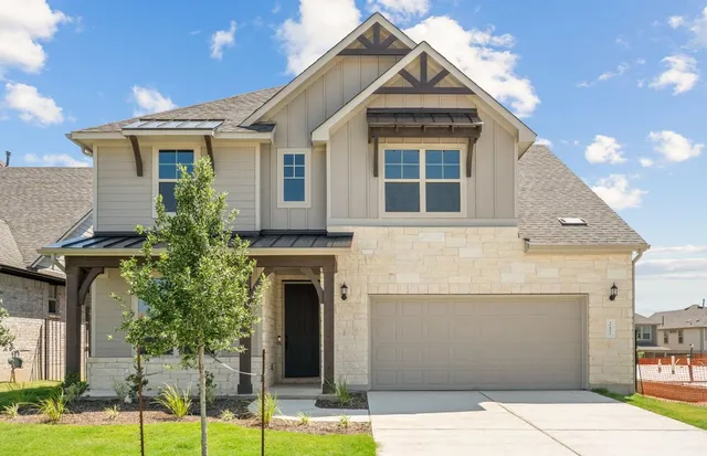 a front view of a house with garage