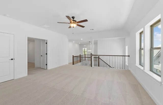 a view of an entryway with wooden floor and a front door