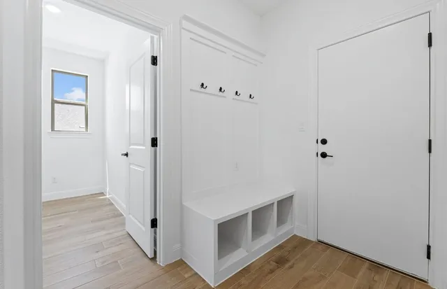 a view of a livingroom with a ceiling fan and window