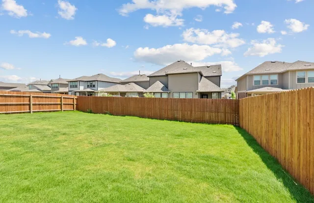 a view of a hallway with wooden floor and closet