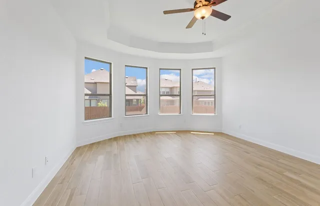 a spacious bathroom with a double vanity sink and mirror