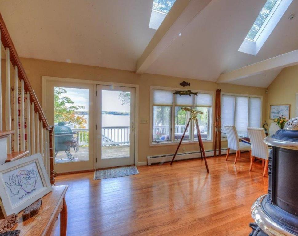 26 Cove Road Forestdale, MA 02644 - Photo 12 of 35 a view of an empty room with wooden floor and a window