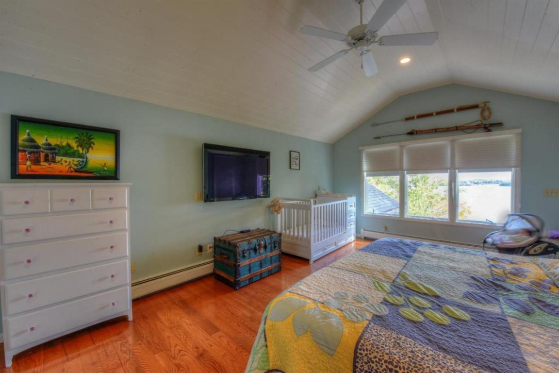 26 Cove Road Forestdale, MA 02644 - Photo 15 of 35 a bedroom with furniture and a flat screen tv