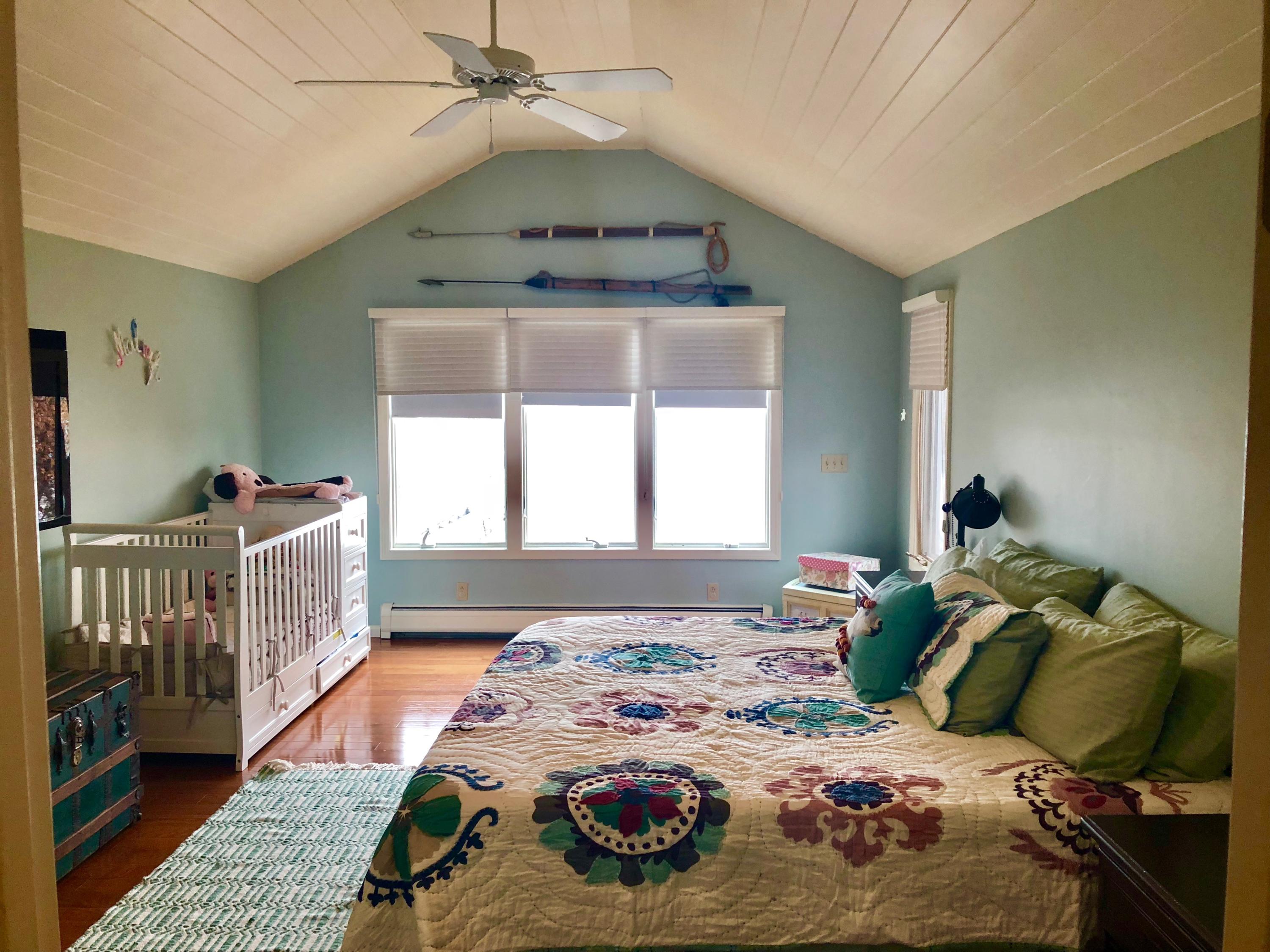 26 Cove Road Forestdale, MA 02644 - Photo 16 of 35 a bedroom with a bed and wooden floor