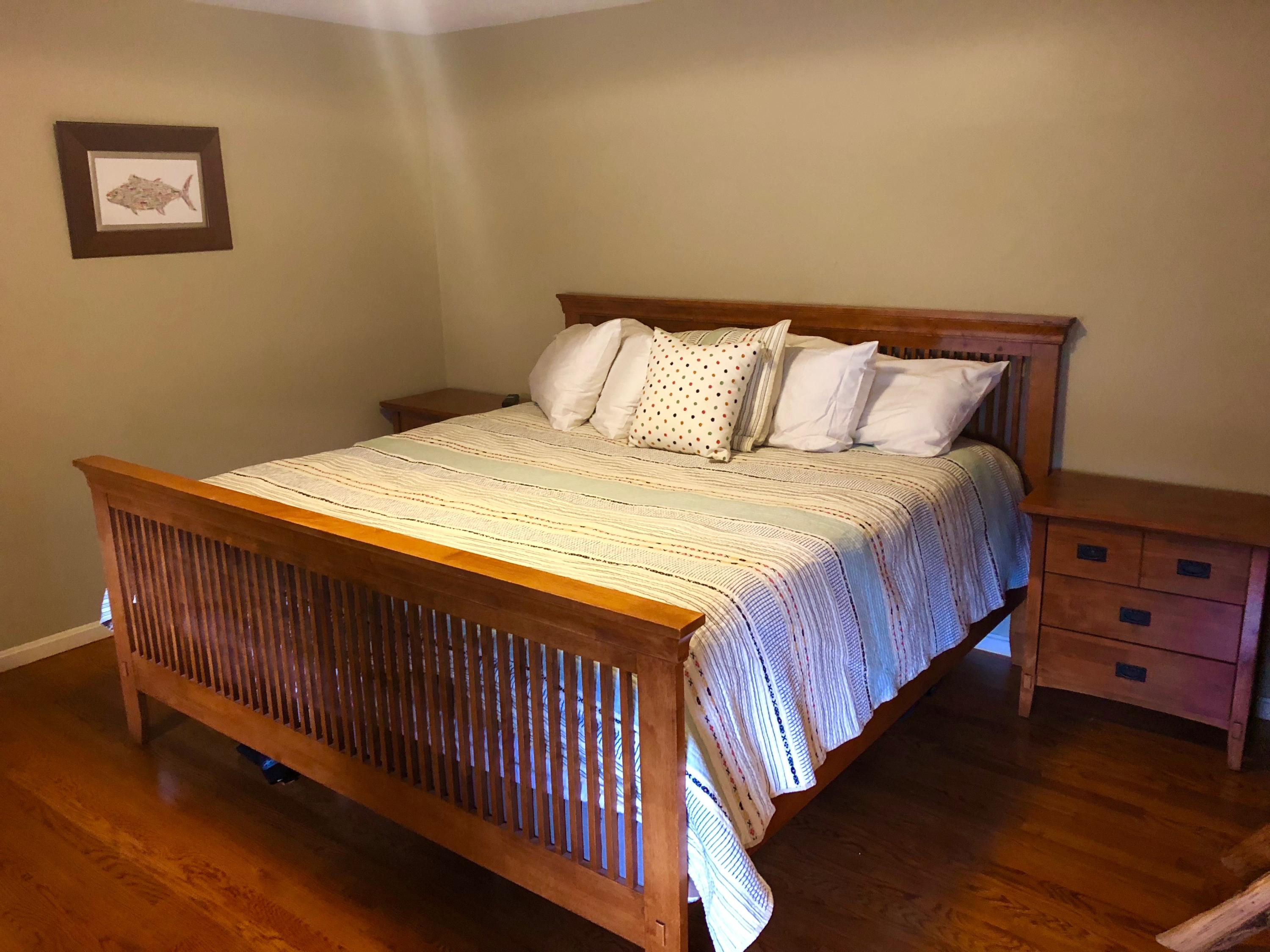 26 Cove Road Forestdale, MA 02644 - Photo 19 of 35 a bedroom with a bed and wooden floor