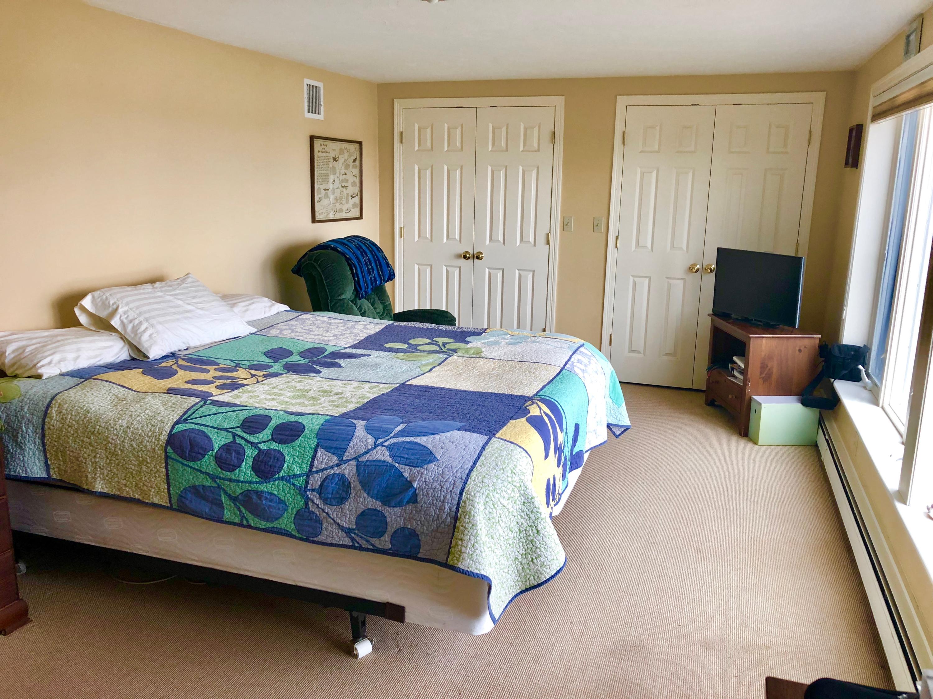 26 Cove Road Forestdale, MA 02644 - Photo 32 of 35 a bedroom with a bed lamp and a window