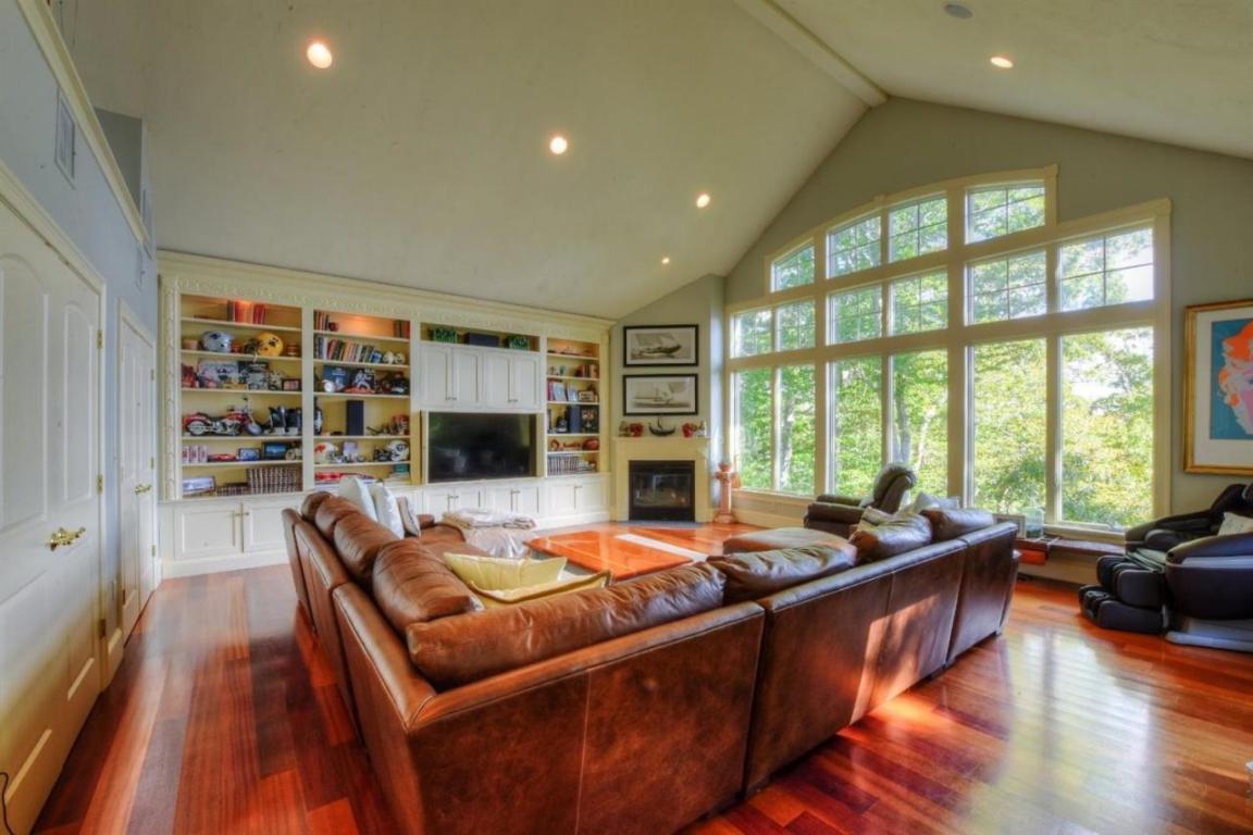 26 Cove Road Forestdale, MA 02644 - Photo 6 of 35 a living room with furniture a flat screen tv and a large window