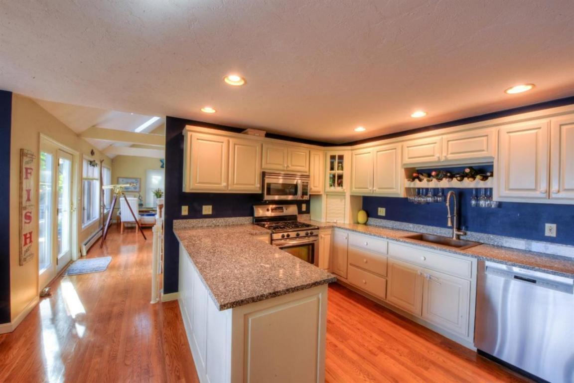 26 Cove Road Forestdale, MA 02644 - Photo 8 of 35 a kitchen with granite countertop counter top space a sink appliances and cabinets