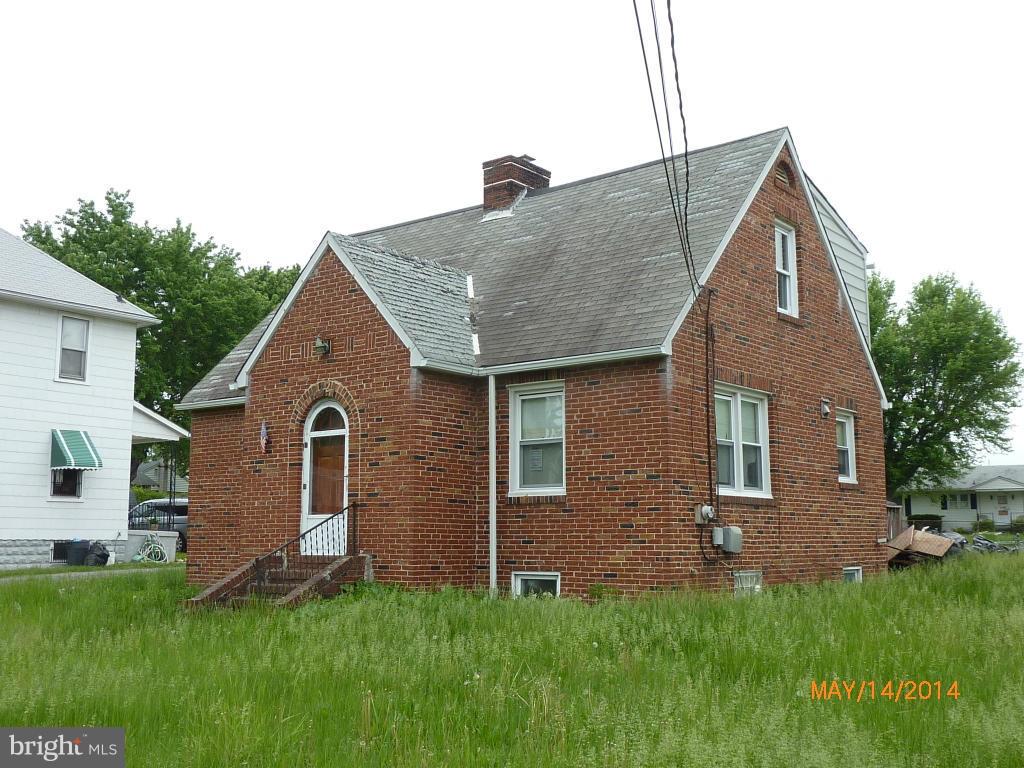 8321 Philadelphia Road Baltimore, MD 21237 - Photo 1 of 15 a front view of a house with a yard