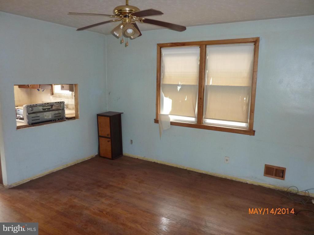 8321 Philadelphia Road Baltimore, MD 21237 - Photo 8 of 15 an empty room with windows and fan