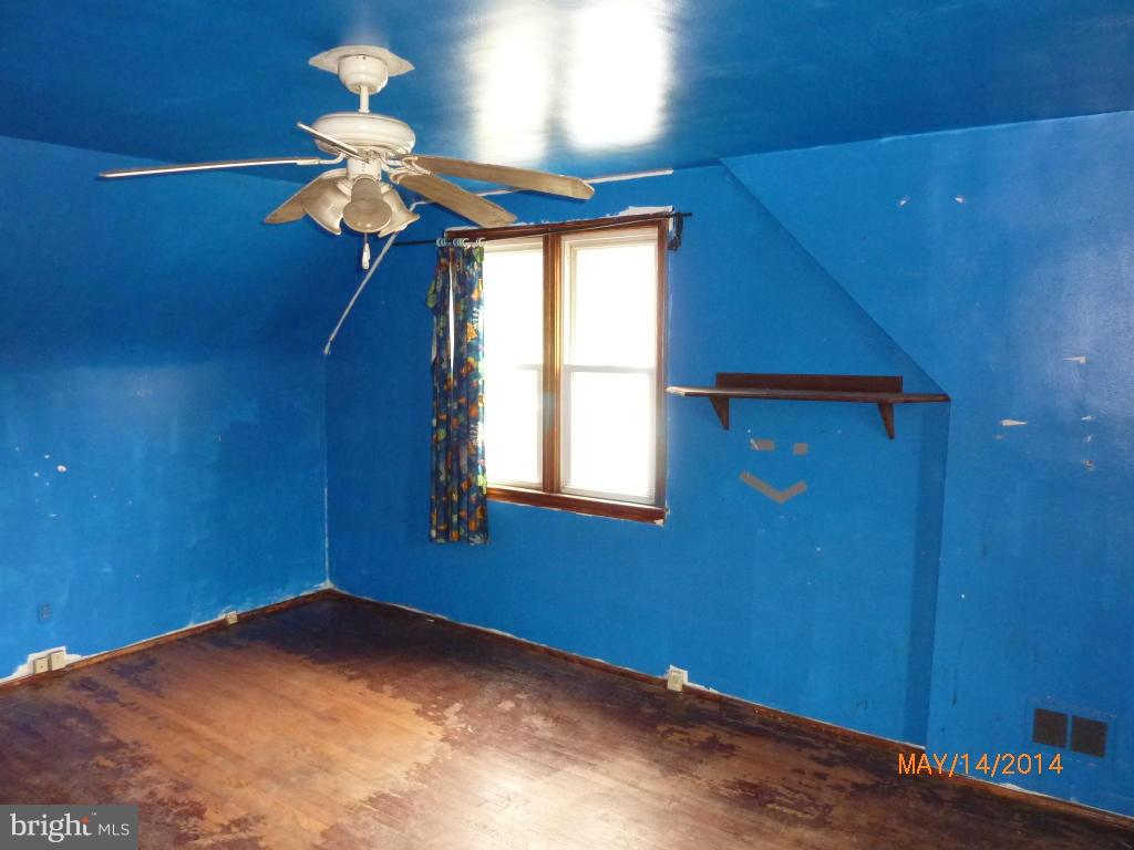 8321 Philadelphia Road Baltimore, MD 21237 - Photo 9 of 15 a view of empty room with chandelier fan and a window
