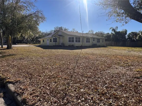 a view of a yard with an outdoor space