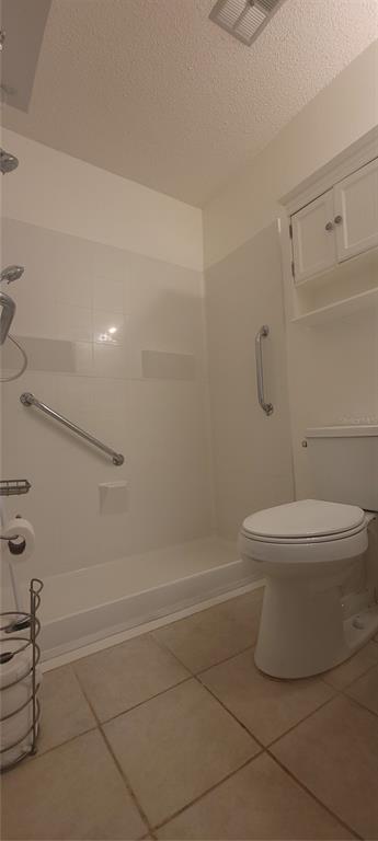 2913 Forrestal Court New Port Richey, FL 34655 - Photo 11 of 16 a white toilet sitting next to a bath tub