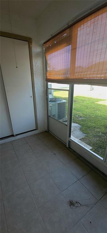 2913 Forrestal Court New Port Richey, FL 34655 - Photo 14 of 16 a view of an empty room with a fireplace and a window