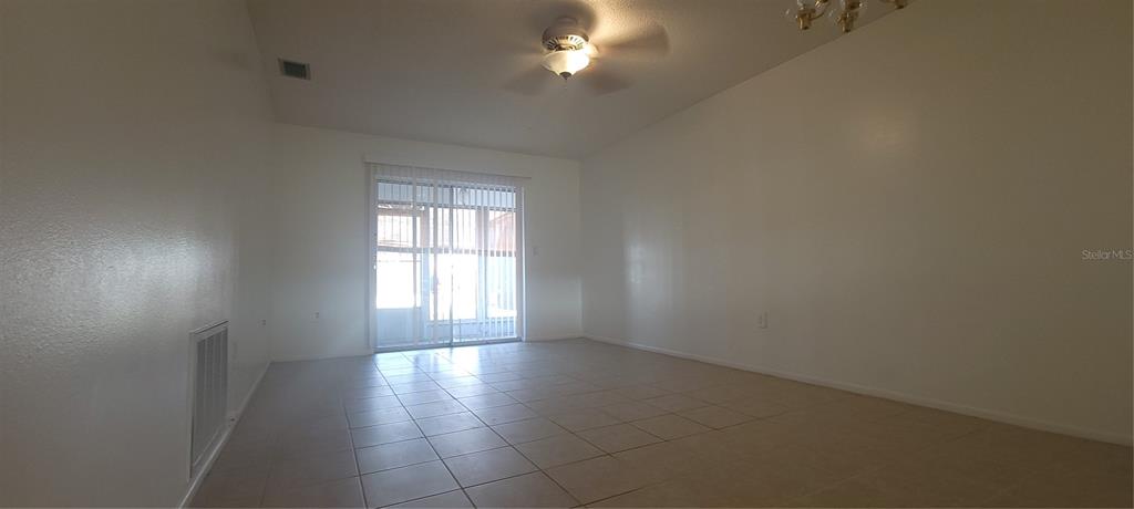 2913 Forrestal Court New Port Richey, FL 34655 - Photo 6 of 16 wooden floor in an empty room with a window