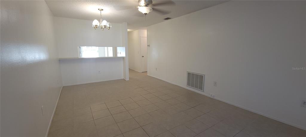 2913 Forrestal Court New Port Richey, FL 34655 - Photo 7 of 16 an empty room with windows and entrance