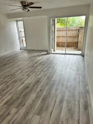 a view of an empty room and a window