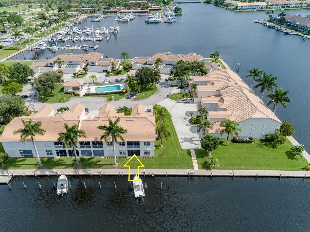 237 Sunrise Cay, Unit 101 Naples, FL 34114 - Photo 2 of 18 an aerial view of a house with a swimming pool yard and outdoor seating