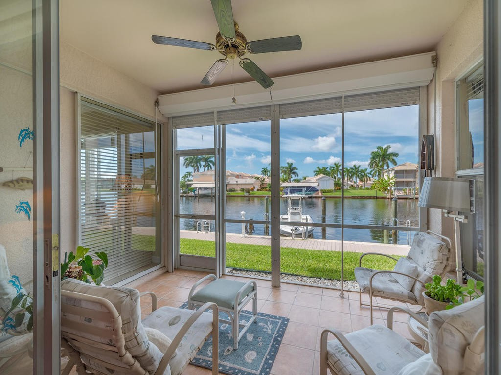 237 Sunrise Cay, Unit 101 Naples, FL 34114 - Photo 11 of 18 a building outdoor space with seating space