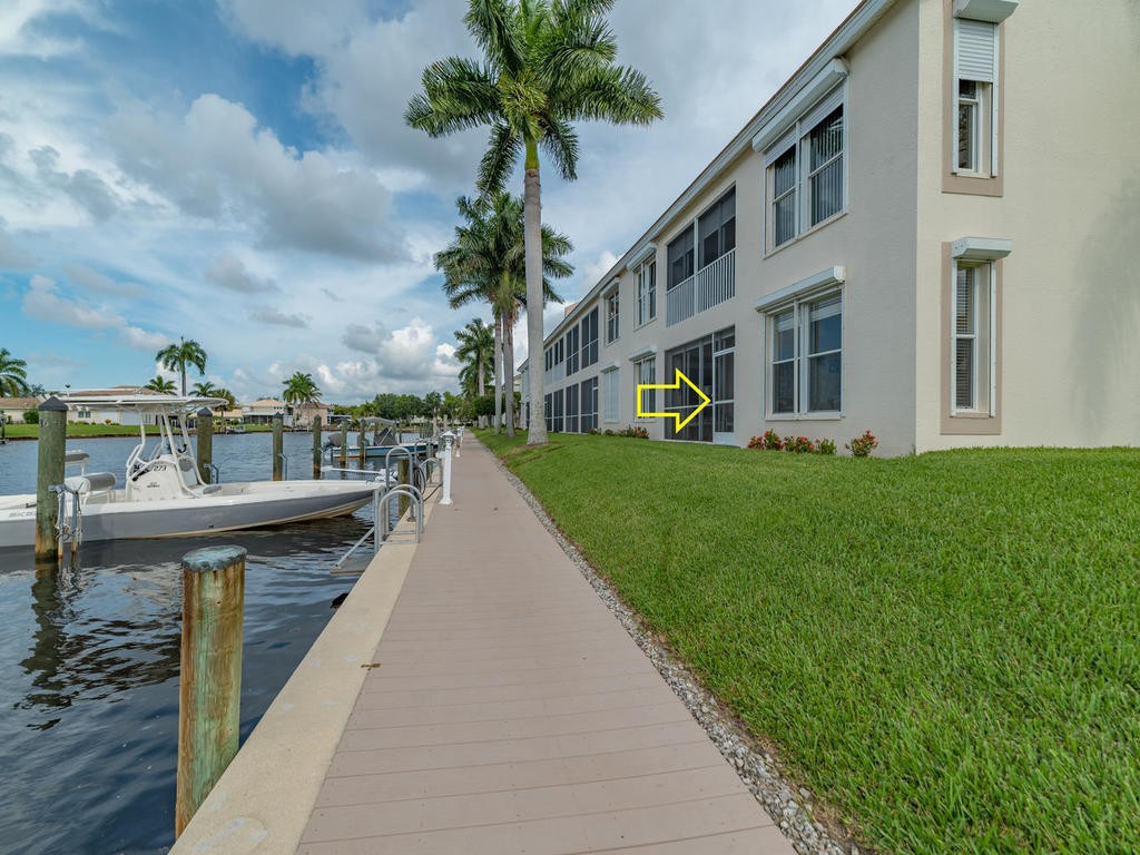 237 Sunrise Cay, Unit 101 Naples, FL 34114 - Photo 13 of 18 a view of a house with roof deck front of house