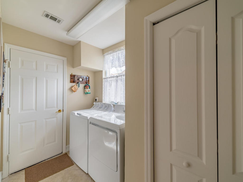 237 Sunrise Cay, Unit 101 Naples, FL 34114 - Photo 18 of 18 a storage room with a sink