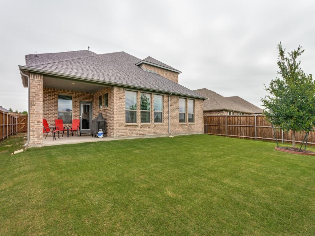 10613 Smiths Bnd Road Fort Worth, TX 76126 - Photo 27 of 29 Spacious grassy yard featuring a covered patio, brick exterior, and a wood privacy fence