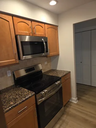 a kitchen with a stove and a microwave