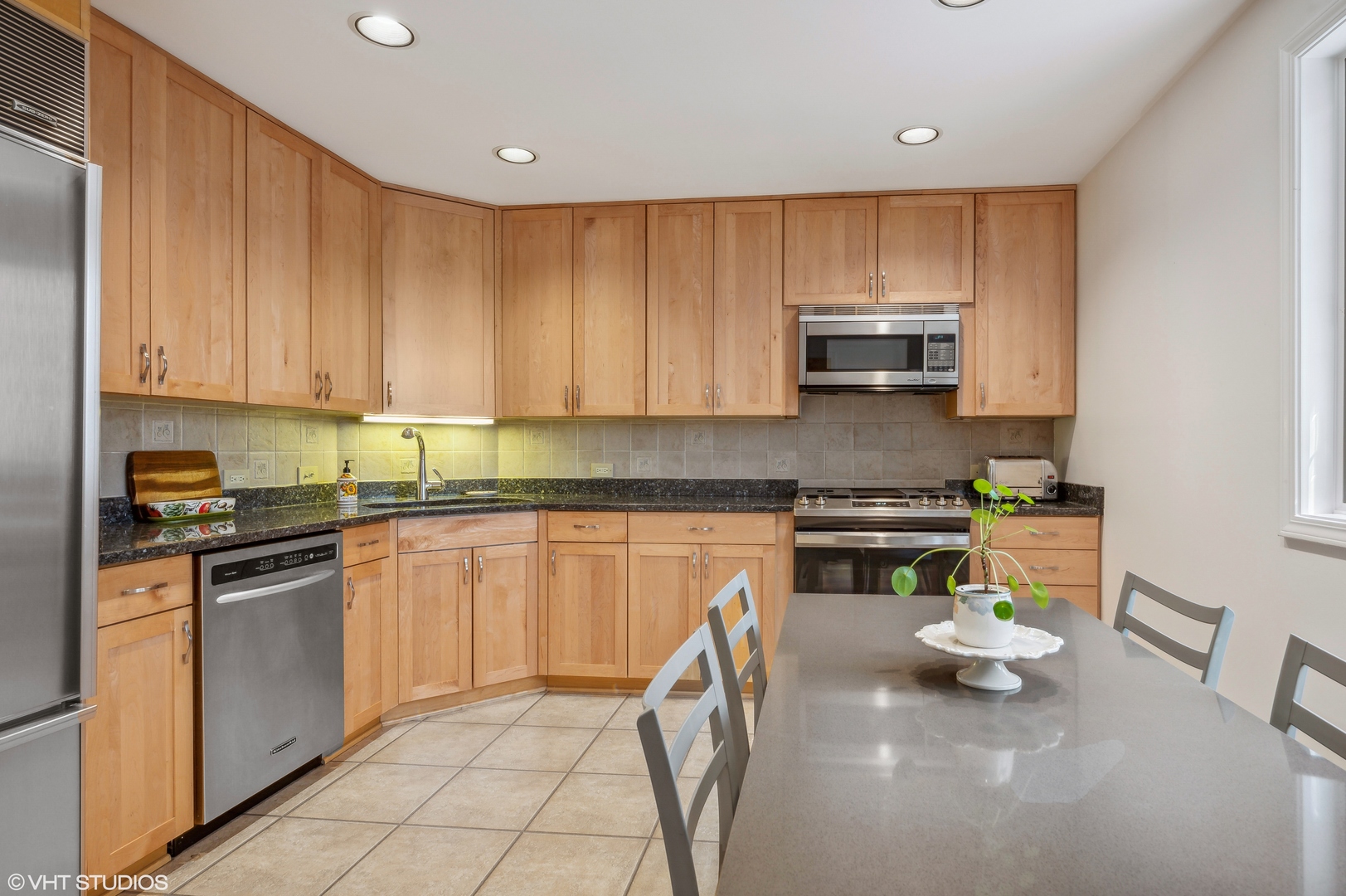 55 West Goethe Street, Unit 1251 Chicago, IL 60610 - Photo 14 of 28 a kitchen with a sink a stove and cabinets
