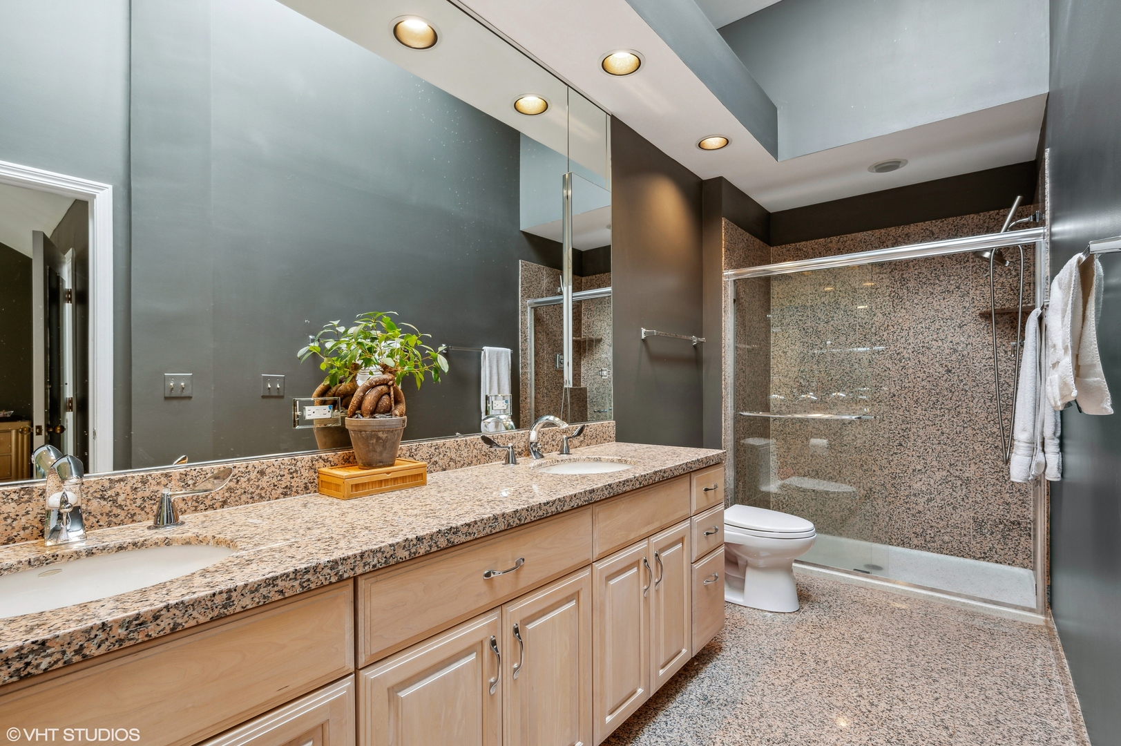 55 West Goethe Street, Unit 1251 Chicago, IL 60610 - Photo 20 of 28 a bathroom with a granite countertop sink toilet mirror and shower