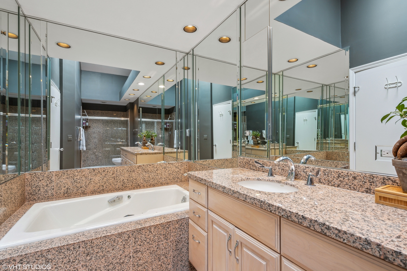 55 West Goethe Street, Unit 1251 Chicago, IL 60610 - Photo 21 of 28 a bathroom with a granite countertop sink mirror and bathtub