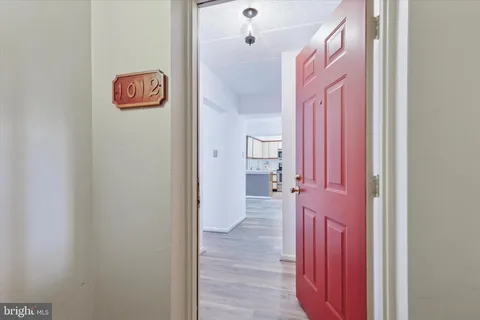 a view of a room that has a bench and a shower curtain