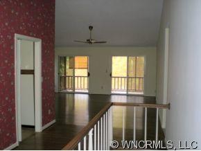 3 Hunting Country Trail Tryon, NC 28782 - Photo 3 of 8 a view of empty room with wooden floor and fan