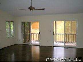 3 Hunting Country Trail Tryon, NC 28782 - Photo 4 of 8 a view of an empty room with wooden floor and a window