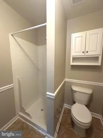 a view of a livingroom with wooden floor