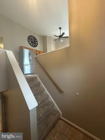 a view of entryway and kitchen