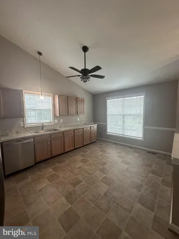 a view of a kitchen with a sink cabinets and window