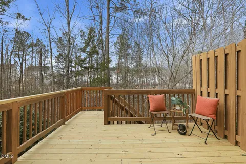 a view of deck with wooden floor and outdoor seating