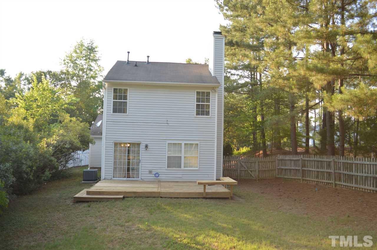5116 Gable Ridge Drive Durham, NC 27713 - Photo 13 of 16 a front view of a house with a yard