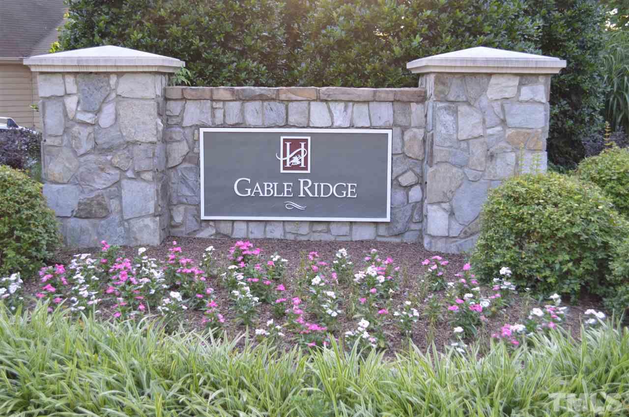 5116 Gable Ridge Drive Durham, NC 27713 - Photo 16 of 16 a sign that is sitting in front of flowers