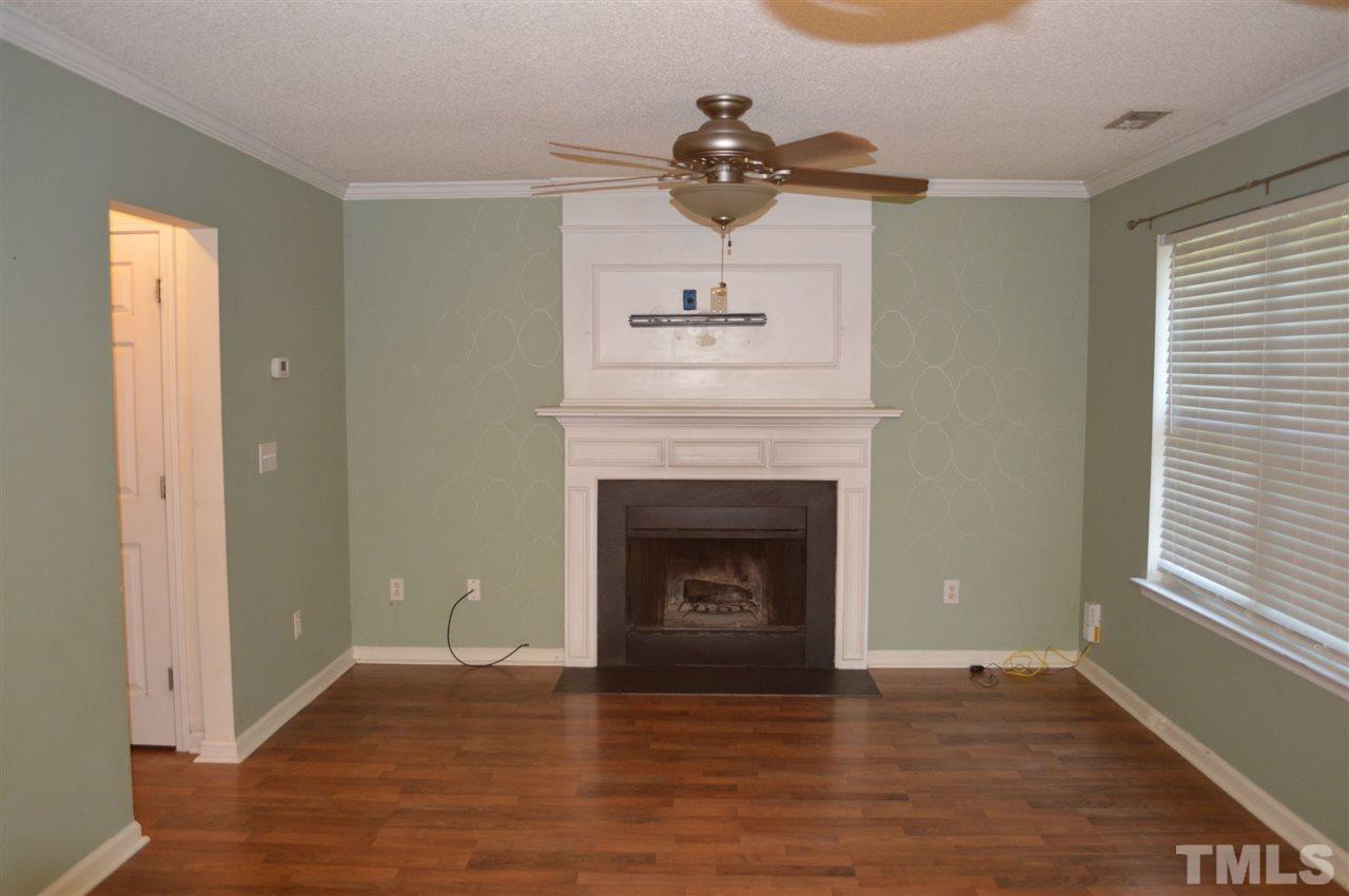 5116 Gable Ridge Drive Durham, NC 27713 - Photo 3 of 16 a view of an empty room with wooden floor and a window