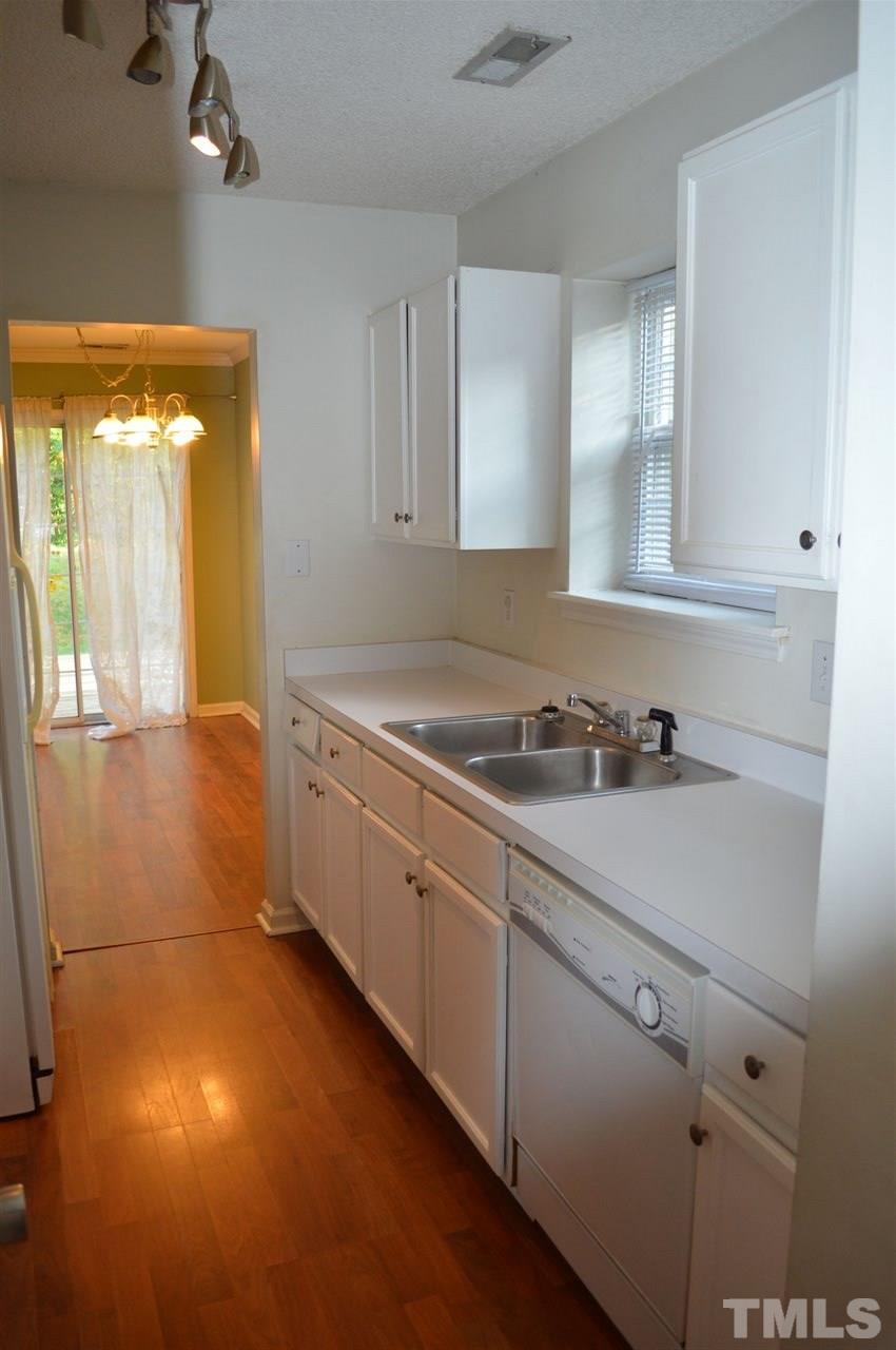 5116 Gable Ridge Drive Durham, NC 27713 - Photo 6 of 16 a room with a sink cabinets and utility room